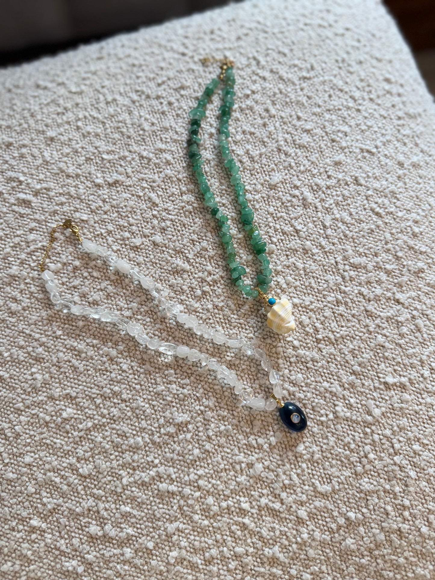 White Beaded Necklace with Blue Charm