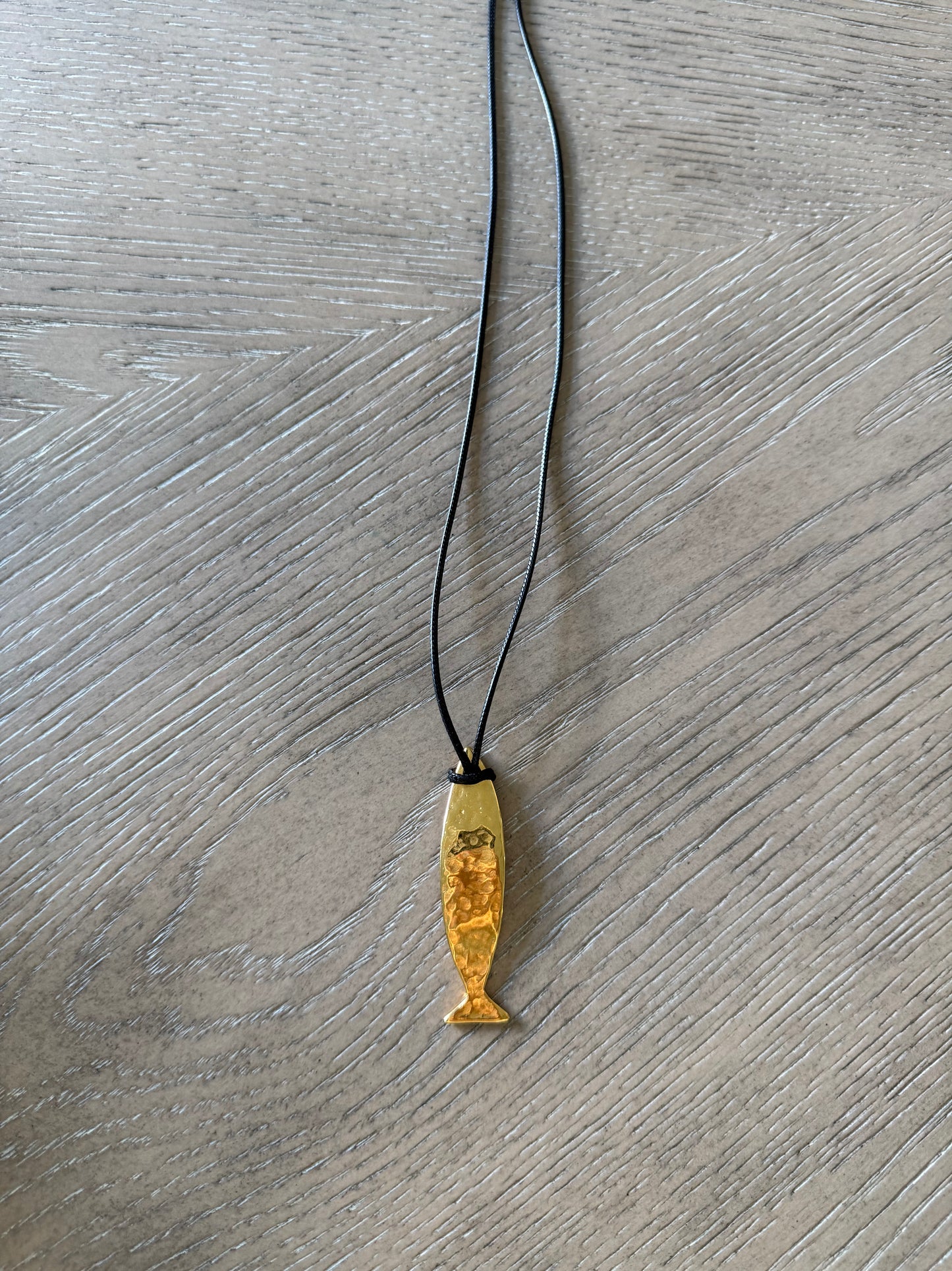 Gold Hammered Fish With Black Cord