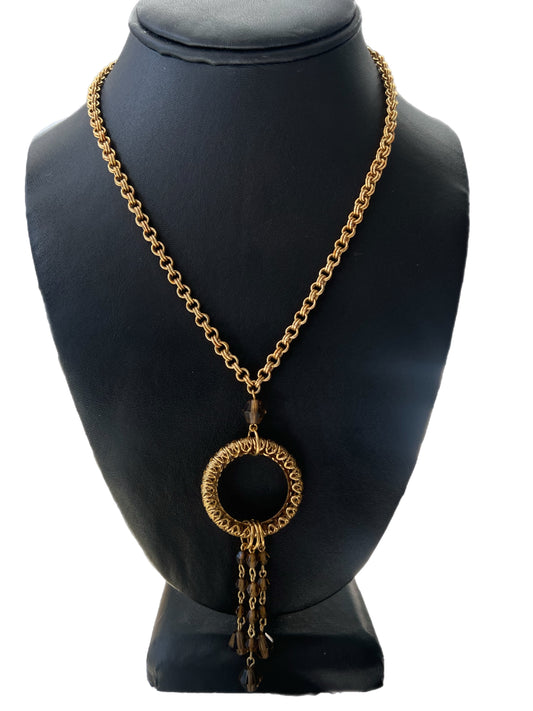 Gold Circle Pendant And Brown Beaded Tassel